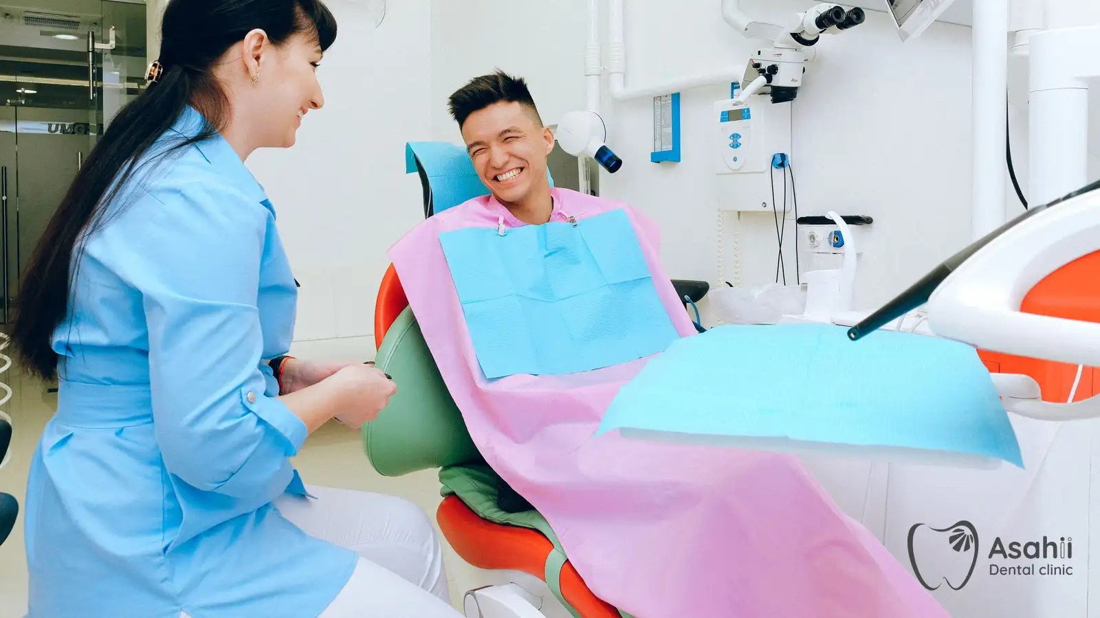 A patient talks with the dentist about caring for a new implant
